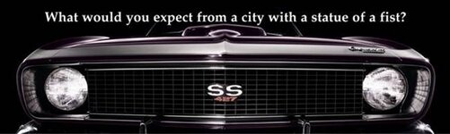 GM-Woodward-billboards-City-with-a-statue-of-a-fist.jpg
